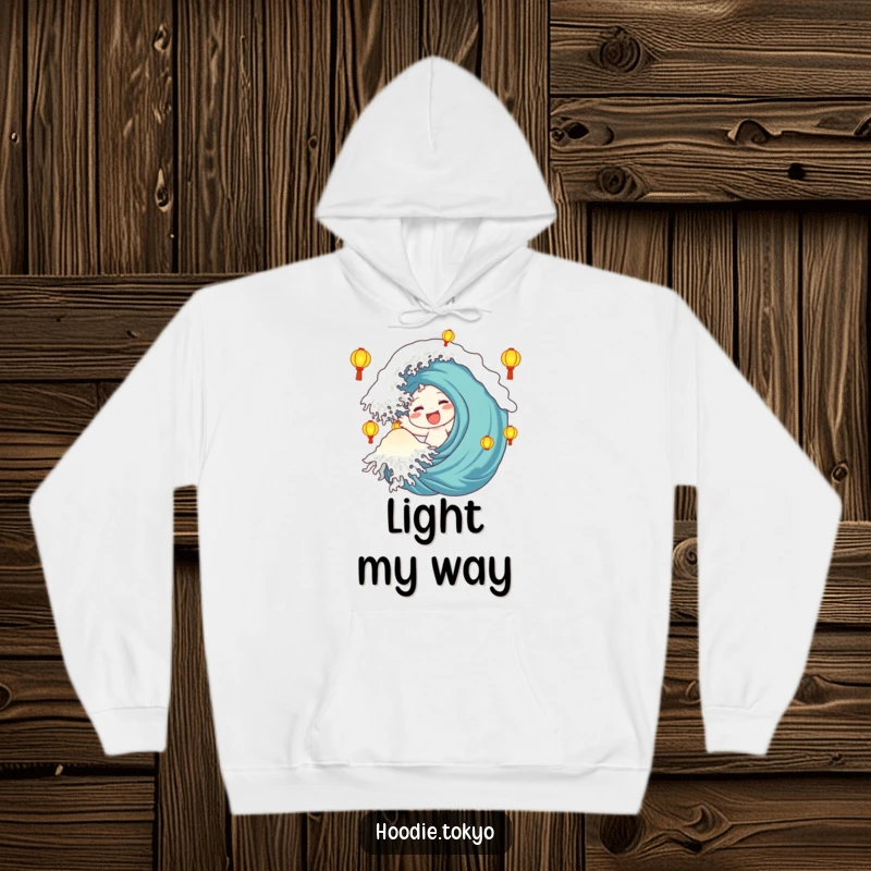 Funny Hoodie: Character making a large, happy wave is enveloped by luminous lanterns, offering a warm embrace.