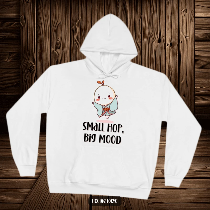 Funny Rice Ball Kimono Hoodie: A soft hoodie featuring a tiny rice ball character in a kimono performing a silly hop, bringing warmth and fun.