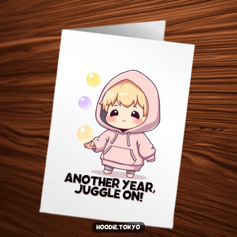 Funny Free Printable Birthday Card: a character in an oversized hoodie playfully juggles glowing orbs.